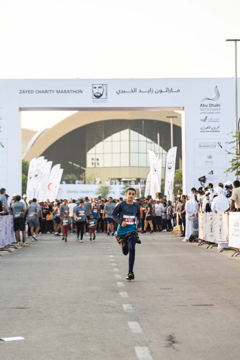 Teenager running at Zayed Charity Marathon Abu Dhabi 2022