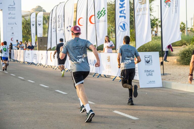 Runners running at Zayed Charity Marathon Abu Dhabi 2022